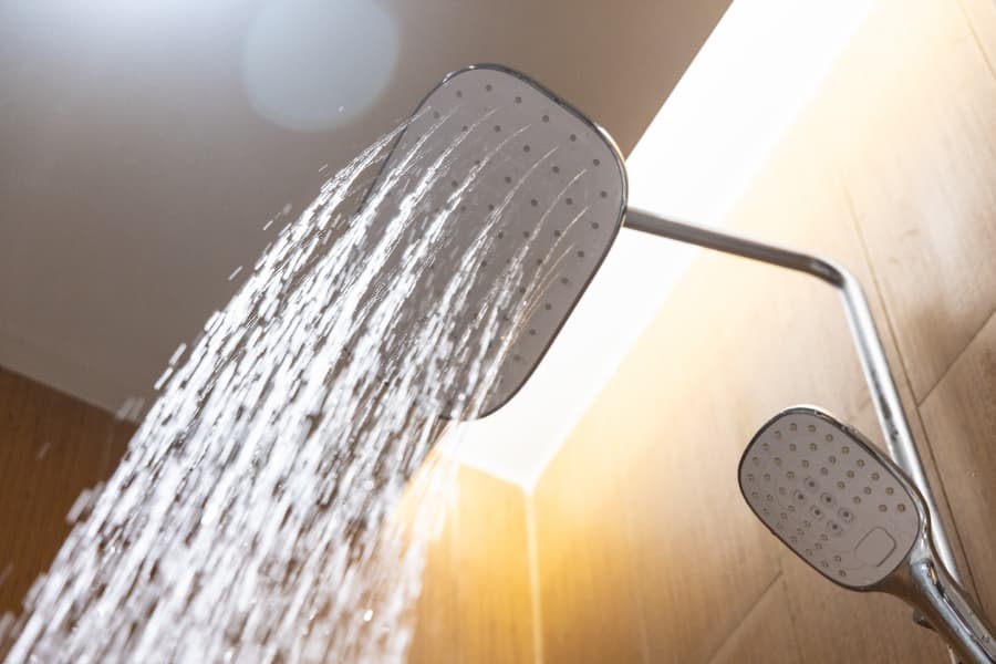 Why shower bodies cause temperature and pressure fluctuations